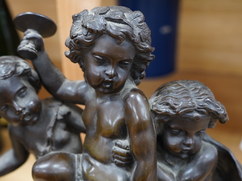 After Claude Michel Clodion (1738-1814), a bronze group of three Bacchanalian cherubs on sienna marble base, 31cm. Condition- fair to good